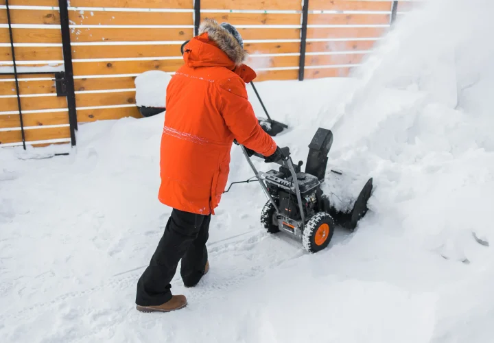 a-man-clear-snow-from-backyard-with-snow-blower